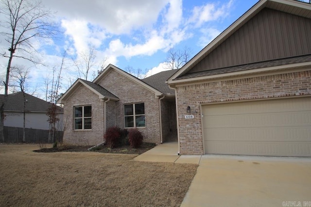 view of front of property featuring a garage and a front yard