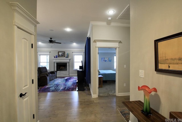 hall featuring crown molding and hardwood / wood-style floors