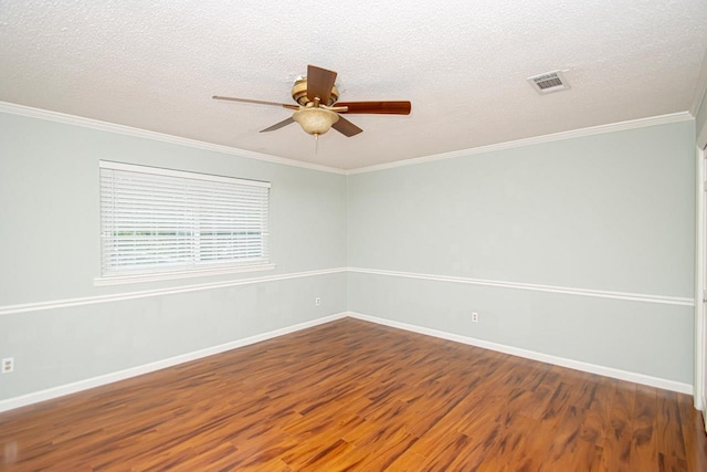 empty room with ornamental molding, hardwood / wood-style floors, a textured ceiling, and ceiling fan