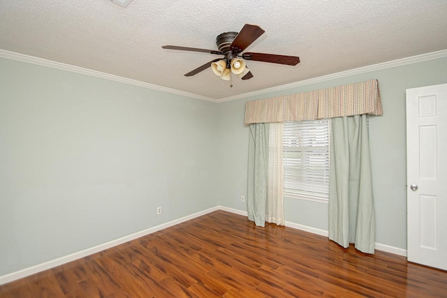 empty room with ceiling fan, crown molding, dark hardwood / wood-style floors, and a textured ceiling