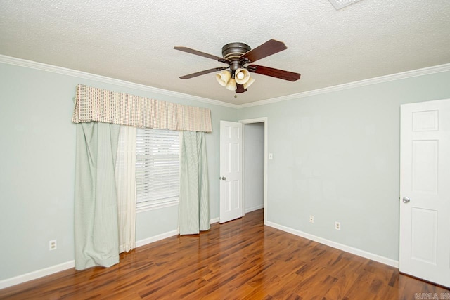 spare room with ornamental molding, ceiling fan, a textured ceiling, and dark hardwood / wood-style flooring