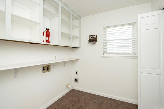 clothes washing area with hookup for an electric dryer and hookup for a washing machine