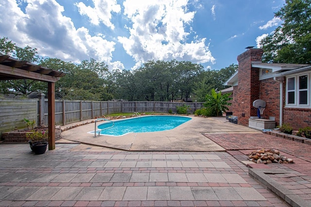 view of swimming pool with a patio area