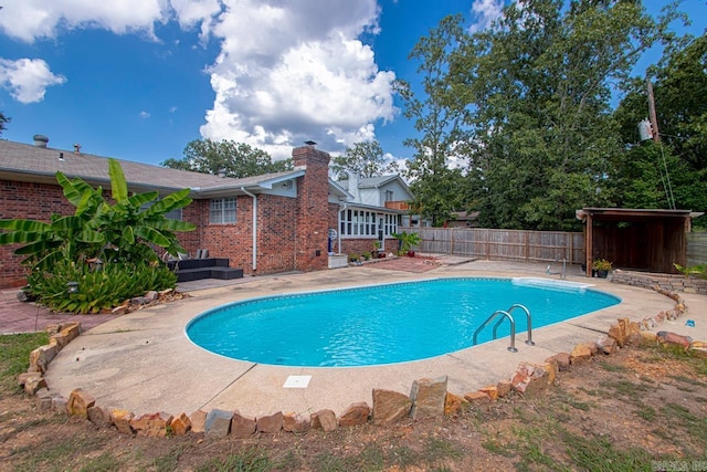 view of pool featuring a patio