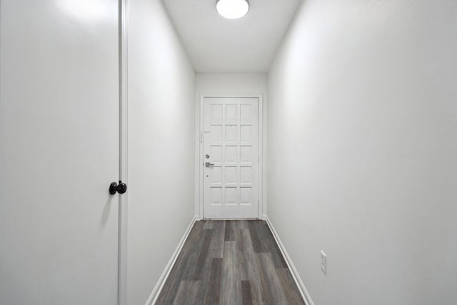 corridor featuring dark hardwood / wood-style flooring