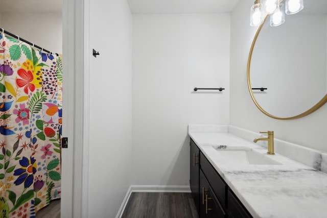 bathroom with vanity and hardwood / wood-style floors