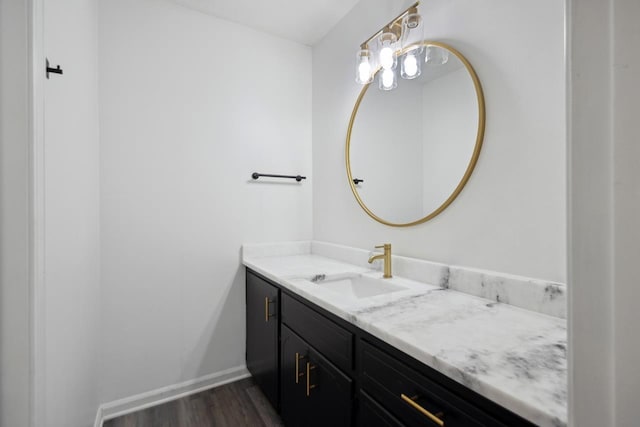 bathroom with vanity and wood-type flooring