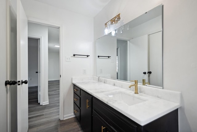 bathroom featuring vanity and hardwood / wood-style floors