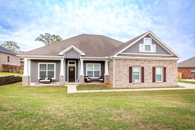 craftsman-style home with a front lawn