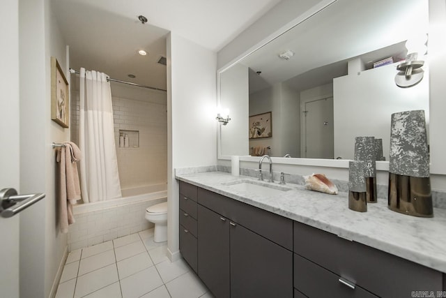 full bathroom with vanity, tile patterned floors, toilet, and shower / bath combo