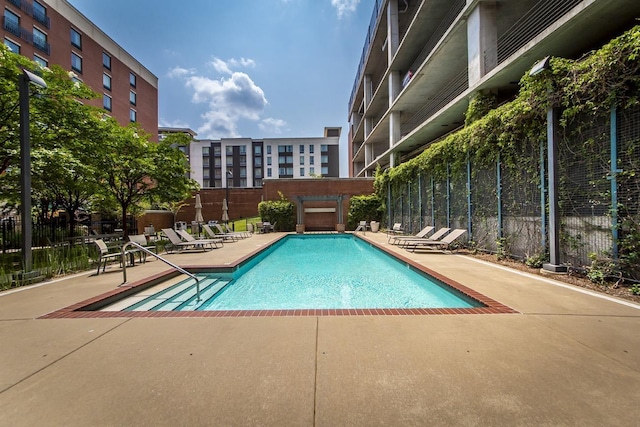 view of swimming pool featuring a patio