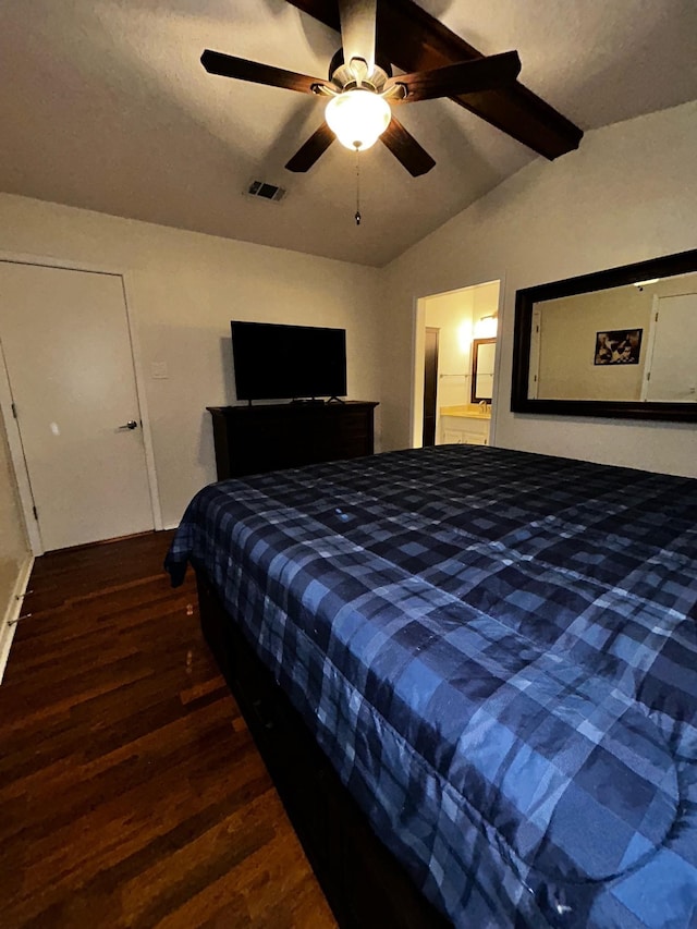 bedroom with ceiling fan, vaulted ceiling with beams, and dark hardwood / wood-style flooring