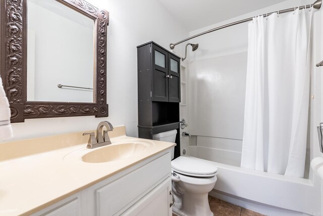 full bathroom featuring shower / tub combo with curtain, vanity, toilet, and tile patterned flooring