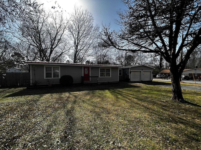 single story home featuring a garage and a front lawn