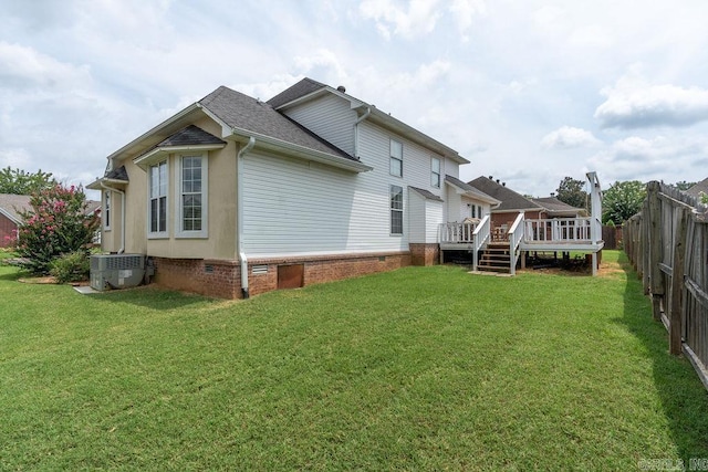 view of property exterior featuring cooling unit, a yard, and a deck