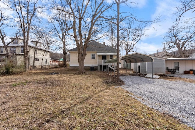 rear view of property featuring a carport