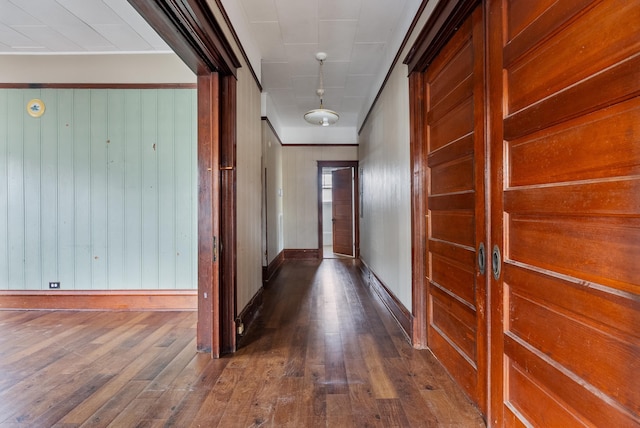 hallway with dark hardwood / wood-style floors