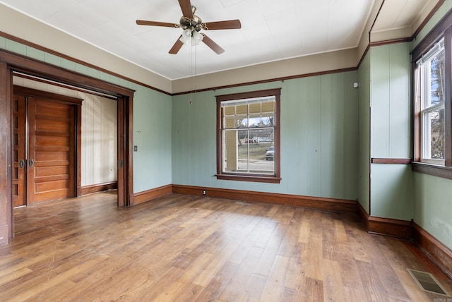 unfurnished room featuring ceiling fan and light hardwood / wood-style flooring