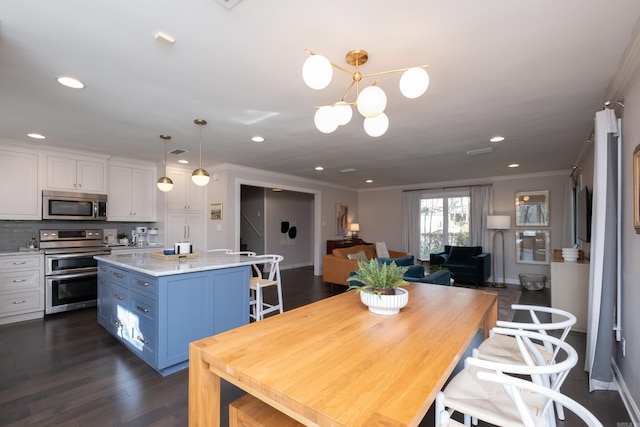 dining room featuring crown molding, dark wood-type flooring, and a chandelier