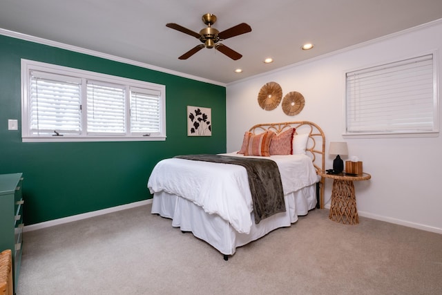 carpeted bedroom with ornamental molding and ceiling fan