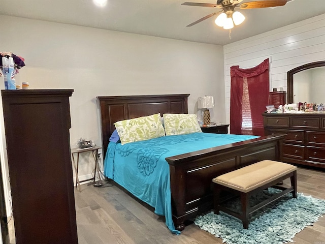 bedroom with ceiling fan and light hardwood / wood-style flooring