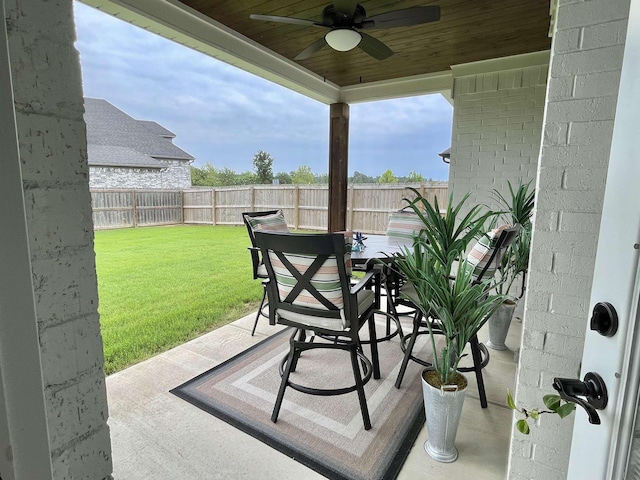 view of patio / terrace featuring outdoor dining area, a fenced backyard, and ceiling fan