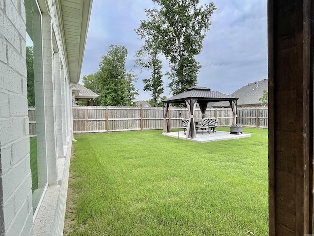 view of yard featuring a gazebo and a patio area