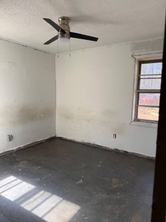 empty room featuring a textured ceiling