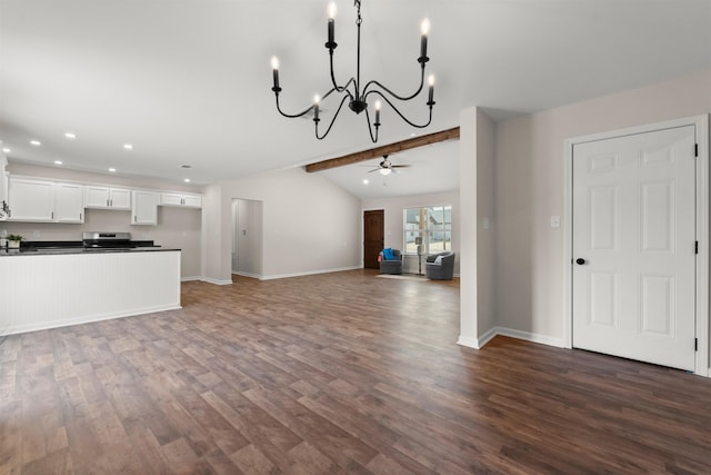 unfurnished living room featuring ceiling fan, dark hardwood / wood-style flooring, and lofted ceiling with beams