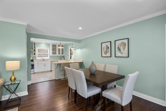 dining area featuring crown molding and dark hardwood / wood-style floors