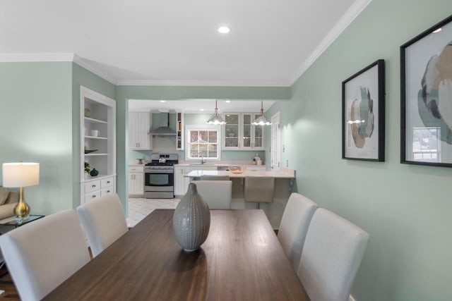 dining space with ornamental molding and built in features