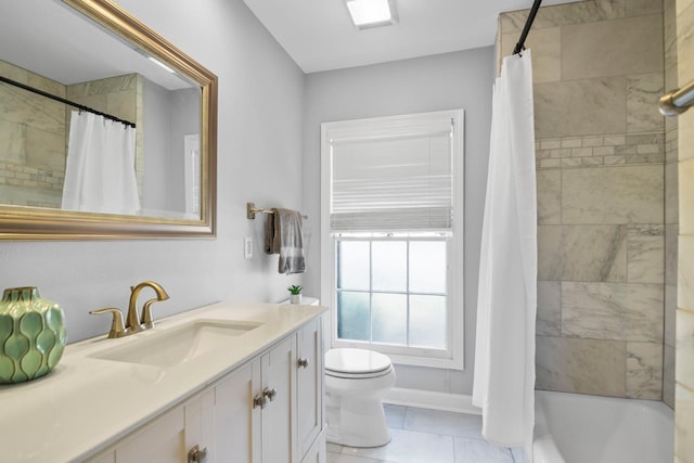 full bathroom featuring tile patterned floors, vanity, toilet, and shower / tub combo