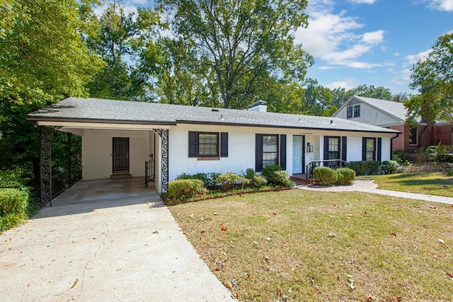 ranch-style house with a front yard, a carport, and covered porch