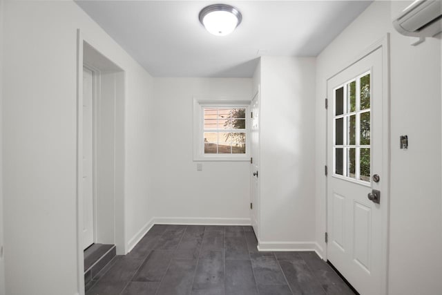 doorway featuring dark hardwood / wood-style floors and a wall mounted air conditioner