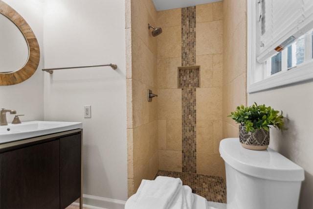 bathroom featuring vanity and a tile shower