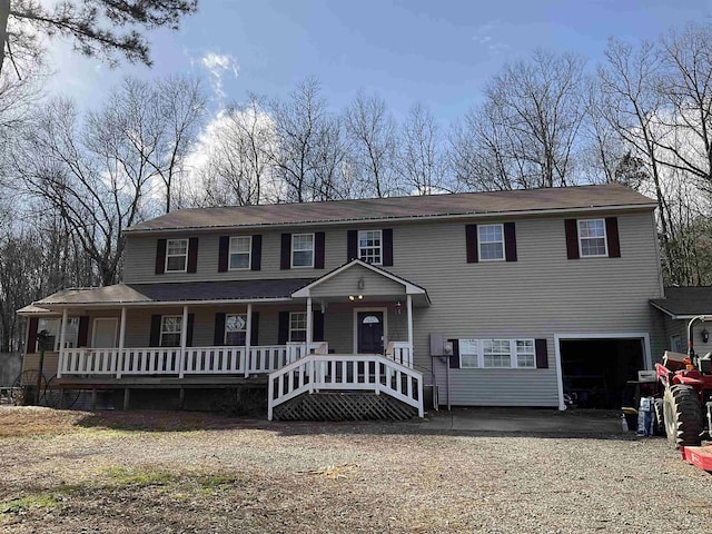 view of front of house with a garage and covered porch