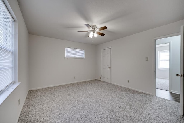 carpeted empty room with ceiling fan