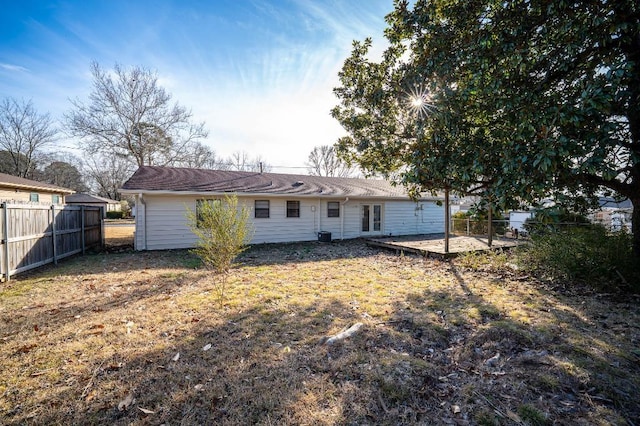 back of house featuring a yard and a patio area