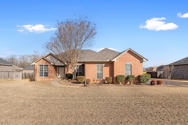 ranch-style house with a front yard