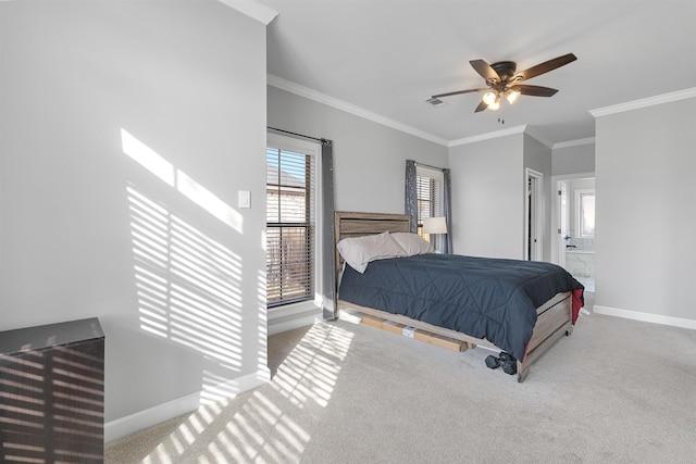 carpeted bedroom with ornamental molding and ceiling fan