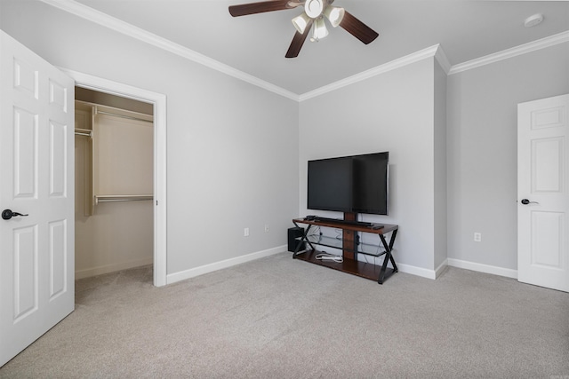 carpeted bedroom featuring ceiling fan, ornamental molding, and a closet