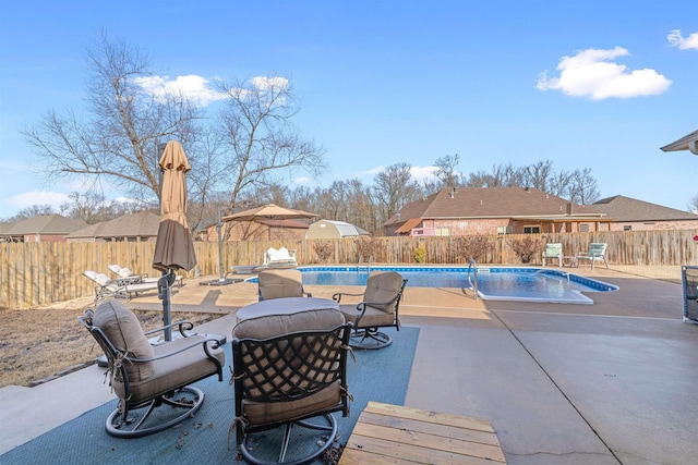 view of swimming pool featuring a patio area