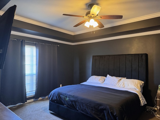 carpeted bedroom featuring ceiling fan and ornamental molding