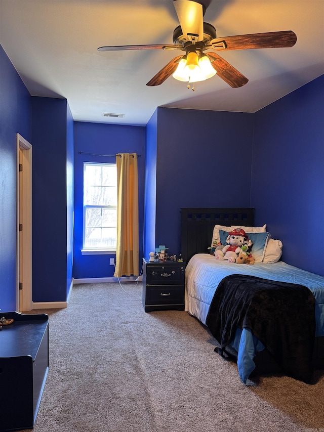 carpeted bedroom with ceiling fan