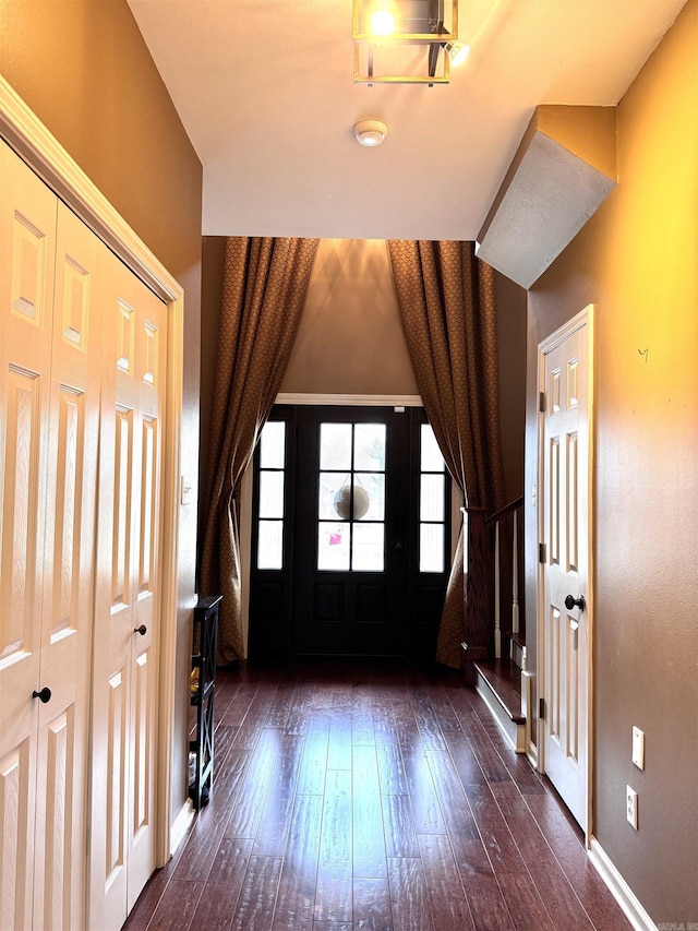 entryway with dark wood-type flooring