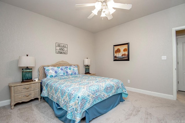 bedroom with light carpet and ceiling fan