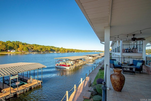 dock area featuring a water view and an outdoor living space