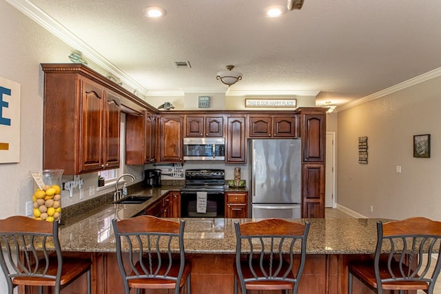 kitchen featuring stainless steel appliances, ornamental molding, sink, and dark stone countertops