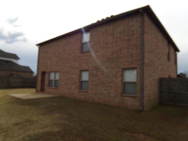 back of property featuring a patio area