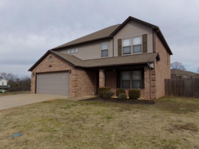 view of front facade featuring a garage and a front yard